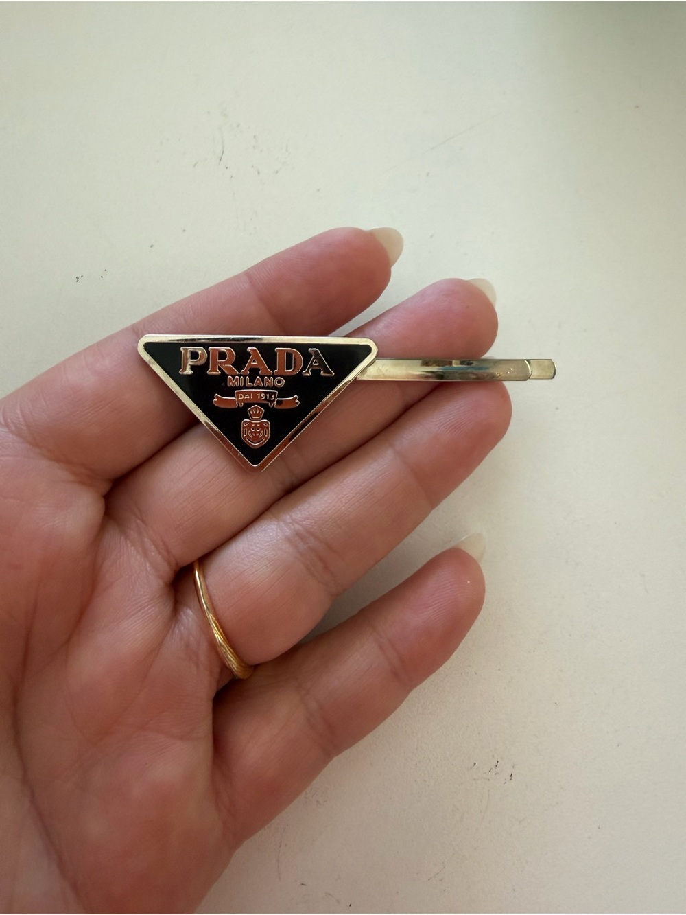 Prada Black and Gold Triangle Logo Cuff Link